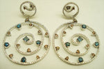 Blue, champagne, brown and white diamonds set in a magnificent 18-karat gold haute couture earring